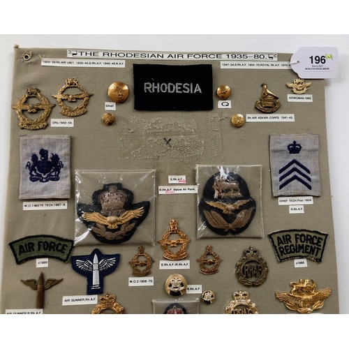 196 - Rhodesian Air Force 43 items of insignia.  Board with good display of metal and cloth badges and but... 