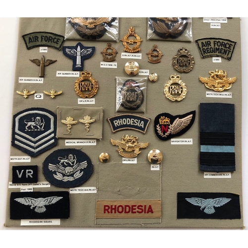 196 - Rhodesian Air Force 43 items of insignia.  Board with good display of metal and cloth badges and but... 