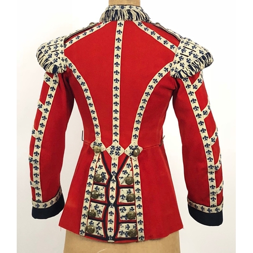 306 - Grenadier Guards 1926 dated Bandsmans tunic.  Scarlet woollen cloth with dark blue facings to the cu... 