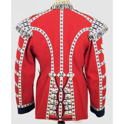 307 - Welsh Guards 1963 dated Drummers tunic.  Scarlet woollen cloth with dark blue facings to the cuff an... 