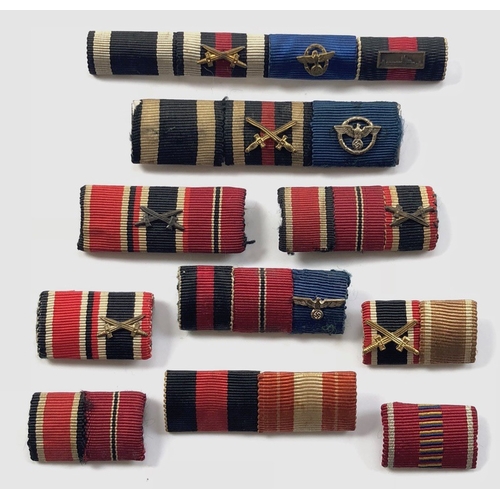 German Third Reich 10 medal ribbon bars.  All in good order (except one missing hook), several with emblems.