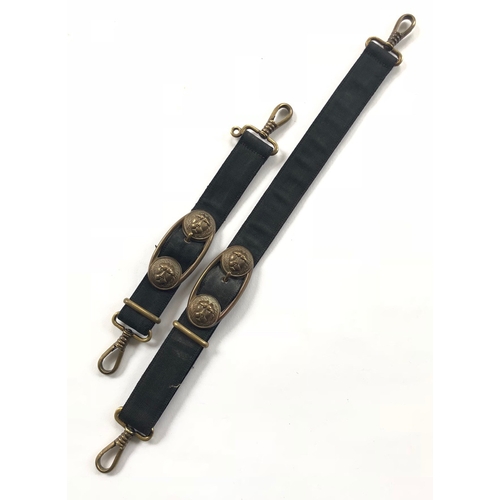 German Third Reich Kriegsmarine Navy Officer pair of dagger suspension straps.  A good pair of simulated black ribbed silk, black velvet backed, with gilded lion head mounts, spring clips. Gilt dulled to base metal, service and some age wear.