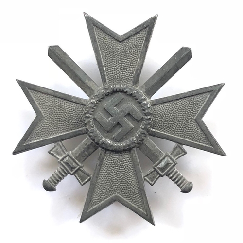 German Third Reich 1939 War Merit Cross 1st Class with swords by Steinhauer & Lück.  Good die-cast silvered example with hinged tapered pin impressed 4 and securing hook. Traces of original finish only.