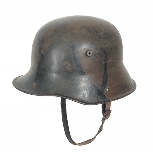 447 - Imperial German WW1 Camouflage Steel Helmet.  A good and scarce example with camouflaged painted fin... 