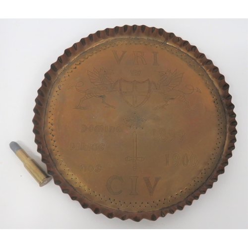 Boer War Period CIV Brass Tray
11 inch brass tray with raised pie crust rim.  The face engraved with dragons holding a shield and crowned sword CIV.  The dates 1899, 1900.  Together with an inert Martini .577/450 round.  