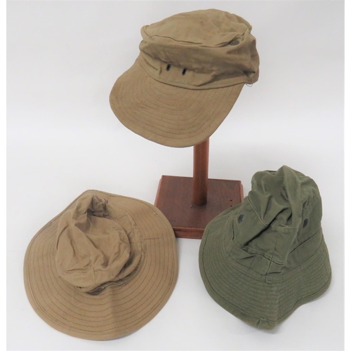 169 - Three British Overseas Hats
consisting light khaki drill bush hat with stitched brim.  Interior date... 