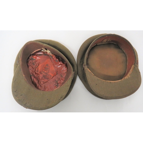 178 - Two British Officer Service Dress Caps
khaki crown, body and stiff peak.  Brown leather chinstr... 