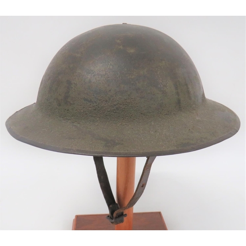 198 - WW1 Period British Brodie Steel Helmet
green painted, rough texture crown and brim with rolled edge.... 