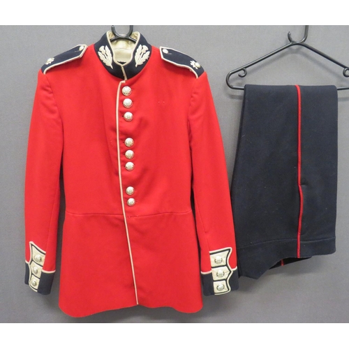 Current Scots Guards Guardsman Tunic
scarlet, single breasted tunic.  Black collar with white piping and embroidery thistles.  Matching shoulder straps with regimental device.  Guards pattern cuffs.  Anodised QC buttons.  Part blanket lining with issue label.  Together with dark blue trousers with red side lines.  Minor wear.  