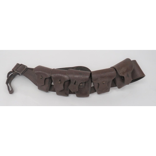 1903 Pattern 50 Round Bandolier
brown leather shoulder strap with five attached pouches, all with top flaps secured by studs.  Lower steel joint triangle and leather belt loop.  Strap with maker's stamp dated 1922.  Some wear. 