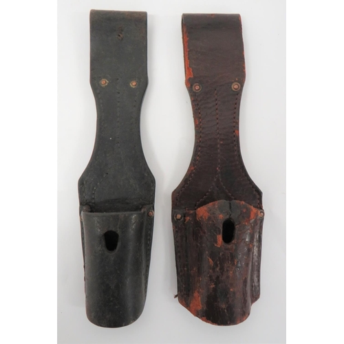 Two Imperial German Bayonet Frogs
consisting black leather example with riveted and stitched seams.  Rear with date 1915 ... Similar example in brown.  2 items.