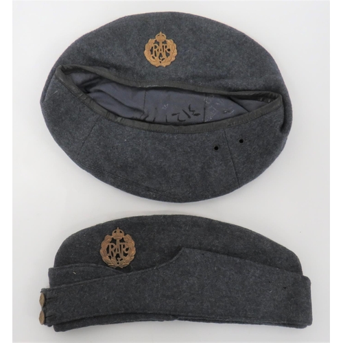 RAF Other Ranks Field Service Cap and Beret
consisting blue grey woollen crown, body and curtain.  The front with two brass, KC RAF buttons.  Brass KC RAF badge. Interior with maker's stamp dated 1945 ... Blue grey woollen beret.  Lower black leather band.  Brass KC RAF badge.  Blue cotton lining with faint maker's details.  2 items.