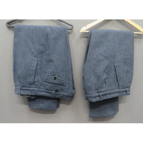 Two Pairs Of RAF Post War Trousers
blue grey woollen, wide leg trousers.  Hidden seat pocket with buttoned flap.  Side slash pockets.  Clean condition.  2 items