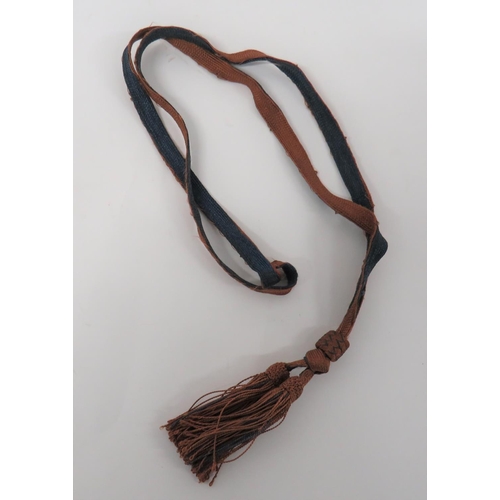 367 - WW2 Japanese Sword Knot
blue and brown silk cord and lower double tassels.  