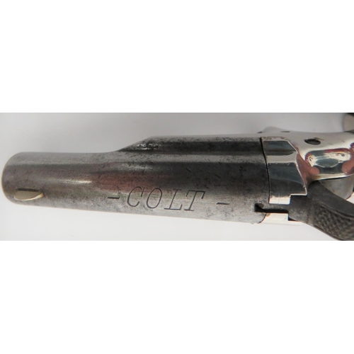 385 - Obsolete Calibre Colt Derringer 
2 1/2 inch, .41 rim fire, side swing out barrel.  White m... 