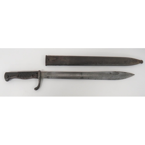 Imperial German Seitengewehr M1898/05 Butcher Bayonet
14 1/2 inch, single edged blade widening towards the point. Wide fuller.  Forte with maker "Gottlieb Hammesfahr Solingen Foche".  Back edge dated 16.  Steel, turn up quillon.  Steel pommel.  Wooden ribbed slabbed grips. Contained in its steel scabbard with some pitting.  