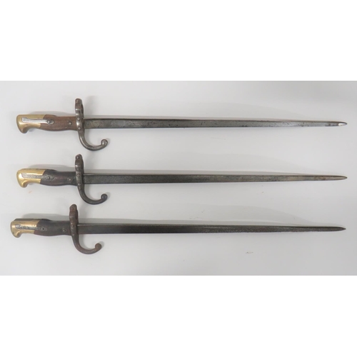 457 - Three French M1874 Gras Bayonets
20 1/4 inch, single edged, T section blades.  Back edges with ... 