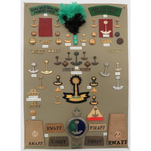 Royal West Africa Frontier Force - 44 Items Of Insignia
display board with good tabulated display of metal and cloth badges including bronzed RWAFF ... White metal RWAFF ... Chrome RWAFF ... Embroidery RWAFF title ... Plated and enamel KC RWAFF car badge.  44 items.  Bob Betts collection. 