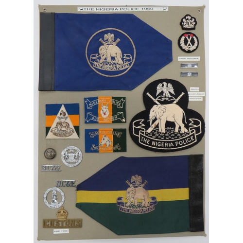 93 - Nigeria Police Post 1960 - 15 Items Of Insignia
display board with good tabulated display of metal a... 