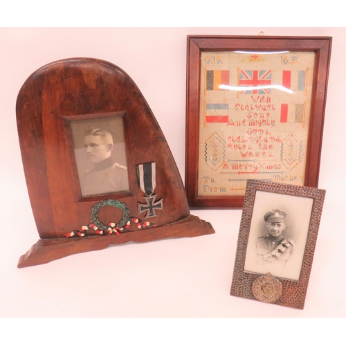 WW2 Propellor Picture Frame
wooden propellor tip with cut out frame.  Central German picture.  Frame now with added alloy wreath and WW1 Iron Cross ... Copper plated, small picture frame with RE badge ... 1916 cross stitch embroidery with flags and script.  Contained in frame.  