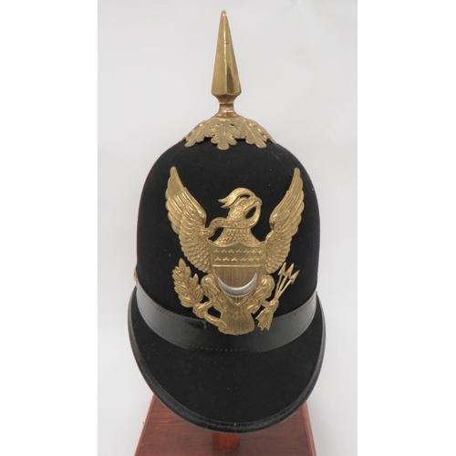 United States Commissary Corps Sergeant's Dress Helmet
black felt, single panel crown with rounded peak and rear brim.  Leather edging.  Brass, oak leaf crown mount and spike.  Brass side mounts with crescent decoration.  Brass eagle badge with central, white metal crescent.  Leather sweatband.