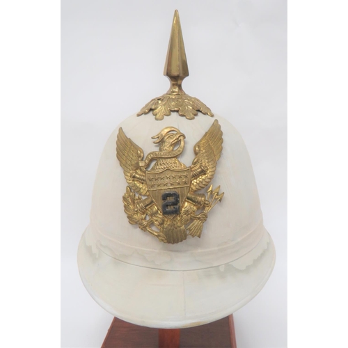 United States 2nd Artillery Summer Pattern Helmet
white blancoed, four panel crown.  Rounded peak and rear brim.  Linen edging.  Brass oak leaf crown mount with brass spike.  Brass eagle Artillery pattern badge with central white metal 2.  Leather sweatband.  Some damage to interior fabric. 