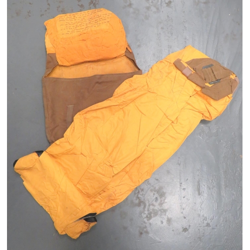 WW2 Dated Naval Yellow Immersion Suit
consisting yellow waterproof trousers with built in lower boot section.  Remains supple ... Yellow waterproof, hooded jacket with maker's stamp dated 1944 and printed instructions "Seaman's Protective Suit (Provided By Ministry of War Transport)" and full wearing instructions.  This jacket is stiff.  All contained within a khaki brown canvas bag.  
These packs were used on board ships and used in rescue boats for downed airmen.  