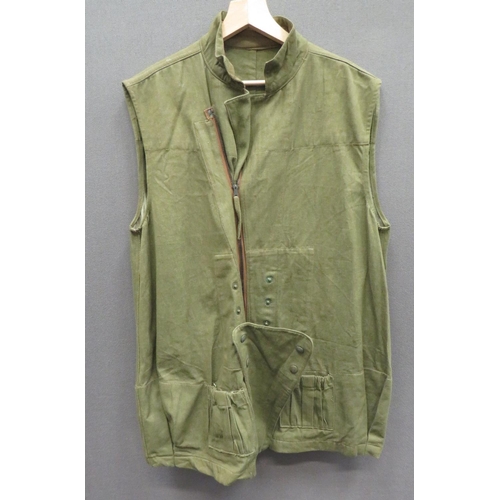 279 - 1944 Dated Parachutist's Jump Over Jacket
green denim, full front zip, sleeveless over jacket.  ... 