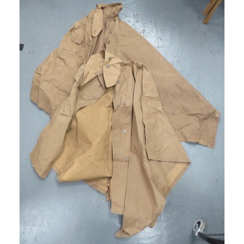 281 - Two WW2 Waterproof Capes
khaki, rubberised linen capes.  Large, fold over collar.  The fro... 