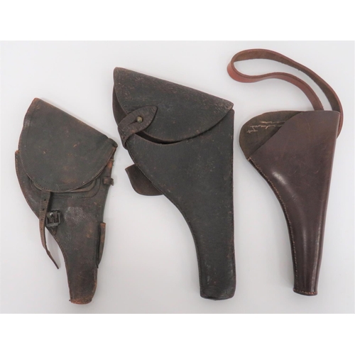 284 - Three Various Revolver Holsters
consisting early style, dark brown revolver holster.  The top f... 