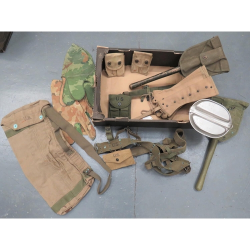 WW1 and WW2 American Webbing Equipment
including 2 x tan canvas Colt magazine double pouches dated 1918 .. Pair tan canvas leggings ... 2 x folding head shovel in canvas cover ... Canvas rocket bag dated 1944 ... Green webbing belt and shoulder braces ... Tan webbing first aid pouch dated 1943 ... Pick head case ... Post war alloy mess tin ... 2 x camouflaged helmet covers.  