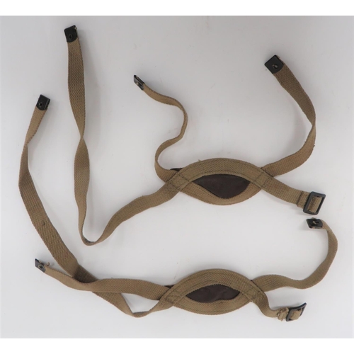 Two Post War Parachute Helmet Chin Straps
khaki webbing, three pointed fastened strap with lower leather and chamois chin cup.  Blackened end tabs and buckle.  Interior maker "C.C.L." dated 1955.  Unused condition.  2 items.