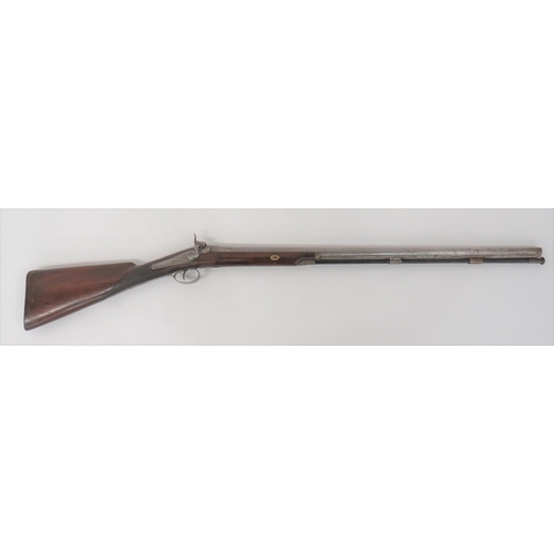 Mid 19th Century Percussion Sporting Gun By Kether
32 inch, 14 bore, smoothbore barrel with lower rib (partly loose).  Back action lock plate with floral scroll engraving and faint maker's name.  Percussion hammer.  Polished, half stock woodwork checkered at the wrist.  Steel butt plate, trigger guard and ramrod pipes.  Wooden ramrod.  
