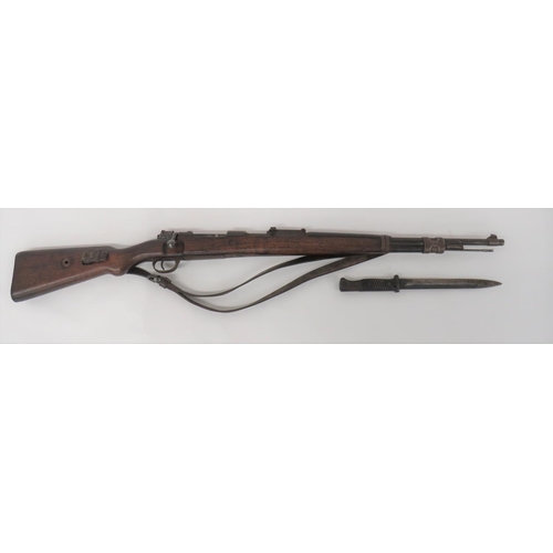 Deactivated WW2 German K98 Mauser Rifle
7.92 mm, 23 3/4 inch barrel.  Front blade sight and rear ladder sight.  Breech marked "S/42" dated 1937.  Turn down bolt handle.  Steel trigger guard and magazine floor plate.  Polished wooden, full stock and top hand guard.  Steel butt plate, barrel band, end cap with bayonet lug and clearing rod.  Leather sling and K98 bayonet by "F2E" dated 43.  Brown composite slab grips.  Complete with current certificate.  