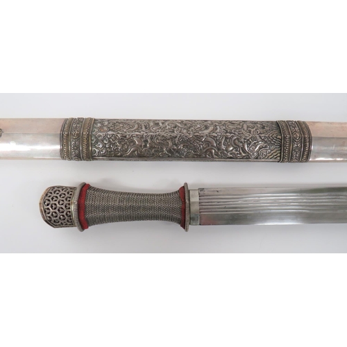 442 - Ornately Decorated Burmese Dha Sword
26 1/2 inch, single edged blade with rounded point.  Six narrow... 