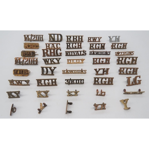 40 x Yeomanry & Cavalry Brass Shoulder Titles
including ND ... RWY ... DLOY ... W DGNS ... WKY ... DY ... B&W DGNS ... YH ... RBH ... EY ... RBY ... KY ... RGH.  Some pairs.  40 items.