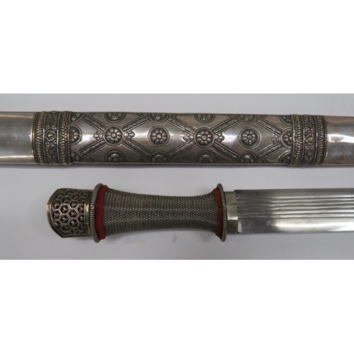 442 - Ornately Decorated Burmese Dha Sword
26 1/2 inch, single edged blade with rounded point.  Six narrow... 