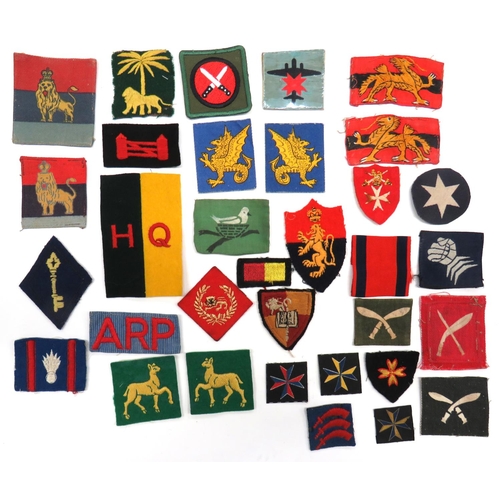 114 - 33 x Formation Badges
including embroidery 28th Searchlight Reg RA ... Embroidery 79 Heavy AA Reg RA... 