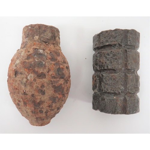 Two Inert WW1 Grenades
consisting a French "lemon", steel fragmentation grenade.  Fuse absent ... British "Battye" tubular steel fragmentation grenade.  The top with wooden plug.  Both items in excavated condition.  2 items.