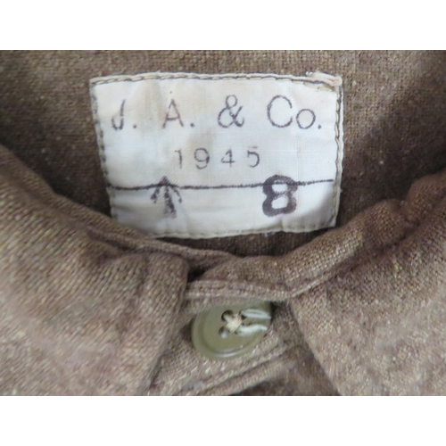 243 - Four WW2 Pattern Military Shirts
consisting khaki woollen, fixed collar example.  Label dated 1945 .... 