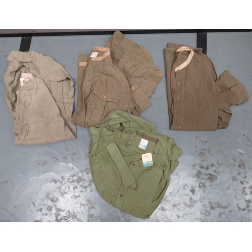 Four WW2 Pattern Collarless Military Shirts
consisting khaki green woollen example with issue label and stamped date 1947.  Full opening front ... Brown/green cotton example.  Half buttoned front ... Khaki tan, similar example ... Similar green cotton example by Clydella.  One loose collar.  