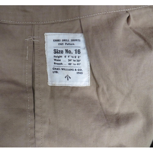 265 - Four Pairs Of WW2 Pattern Military Shorts
consisting light khaki drill shorts.  Side slash pock... 