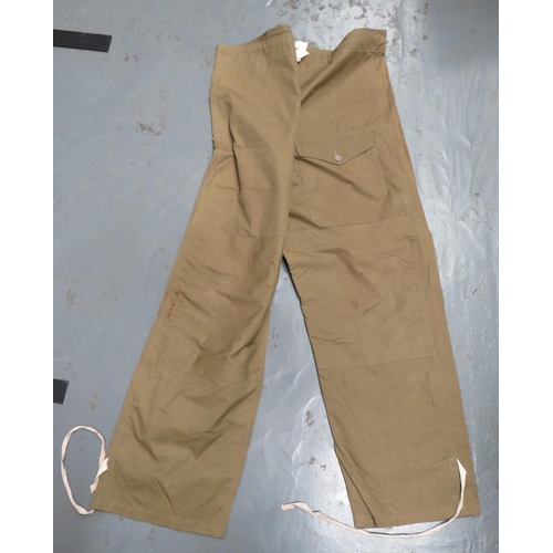 278 - Pair Of 1944 Dated Labrador Windproof Trousers
khaki green cotton, wide leg over-trousers.  Reinforc... 