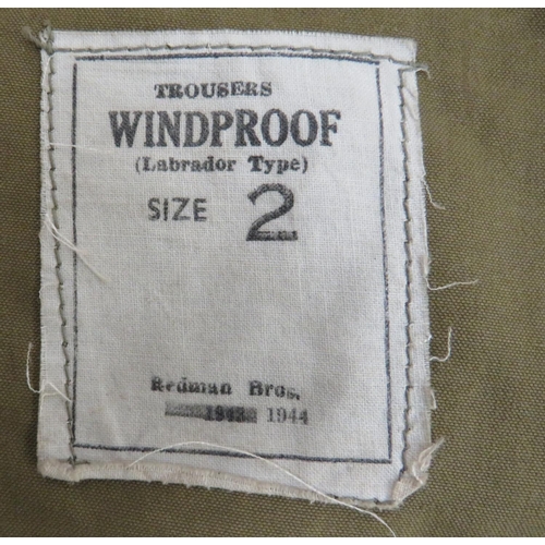 278 - Pair Of 1944 Dated Labrador Windproof Trousers
khaki green cotton, wide leg over-trousers.  Reinforc... 