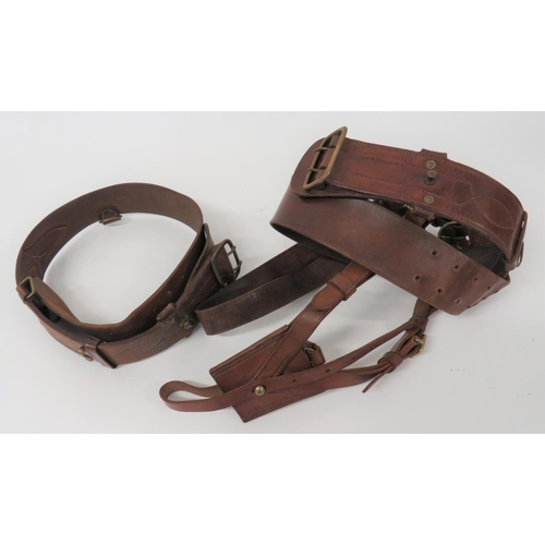 297 - Two Officer Sam Browne Belts
consisting brown leather belt with brass fittings to take double brace ... 