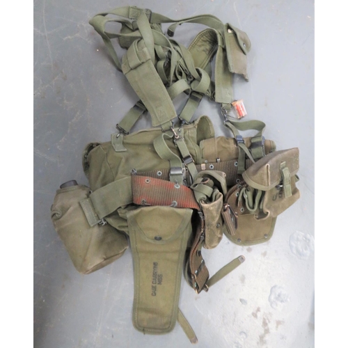 Set Of Post War American Webbing 
consisting belt ... Shoulder yoke ... Pair of M16A1 ammunition pouches ... Compass case ... Entrenching tool case ... Waterbottle and case ... Small pack ... Various straps.  