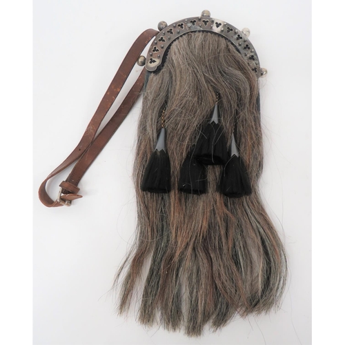 324 - Scottish Dress Sporran
grey brown horsehair.  Black tassels with silvered top bells (1 absent).  Top... 