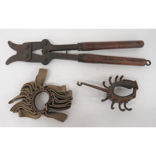 WW1 Dated British Wirecutters And Various Items
steel, rabbit ear wirecutters.  The body with maker dated 1918.  Long wooden handles with end hanging hook.  Together with a leather and canvas, loop, tent pole, rifle holder.  Strap with maker dated 1916 ... Leather tent pole strap with brass hanging hooks.  3 items.