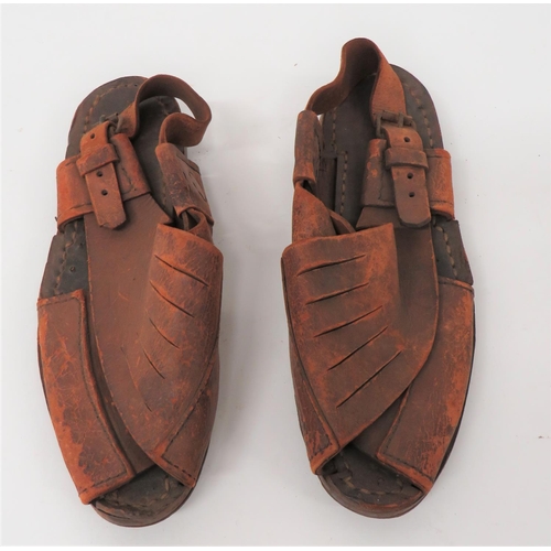 355 - Scarce Pair Of Desert Pattern Sandals
brown leather, cross over top with rear ankle strap.  Fla... 