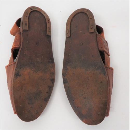 355 - Scarce Pair Of Desert Pattern Sandals
brown leather, cross over top with rear ankle strap.  Fla... 